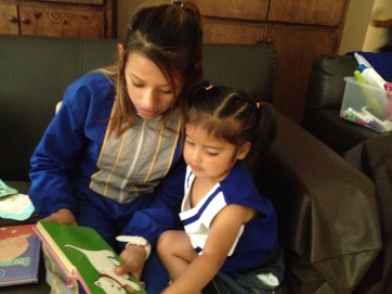 Alejandra passing on her new English skills to Sofi, at another orphanage